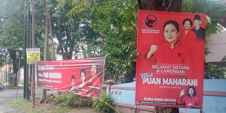 Banner dan spanduk bergambar Puan Maharani didampingi foto Ketum DPP PDI Perjuangan, Megawati Soekarno Putri dan Kakeknya Soekarno di pertigaan jalan Pangsud - Pasar Ikan, Selasa (1/3/2022)