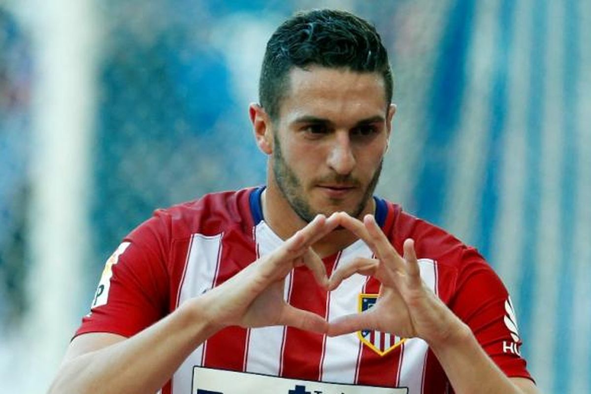 Gelandang Atletico Madrid, Koke, merayakan golnya ke gawang Espanyol pada partai La Liga di Stadion Cornella-El Prat, 9 April 2016.