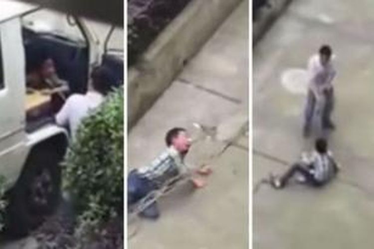 Dalam foto yang diambil dari video yang diunggah ke internet ini, terlihat seorang pria di Zhejiang, China menyeret anak laki-lakinya di trotoar dengan tali terikat di leher bocah itu.