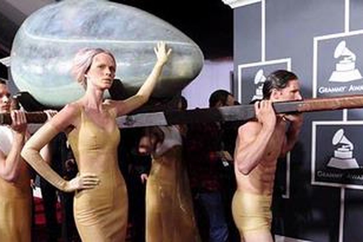 Lady Gaga arrives at the Grammys inside an egg. 