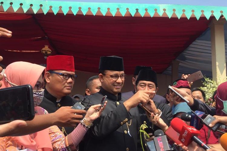 Gubernur DKI Jakarta, Anies Baswedan saat menghadiri Lebaran Betawi di Monas, Jakarta Pusat, Minggu (21/7/2019).