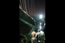 India Bridge Collapses, Killing at Least 130 People