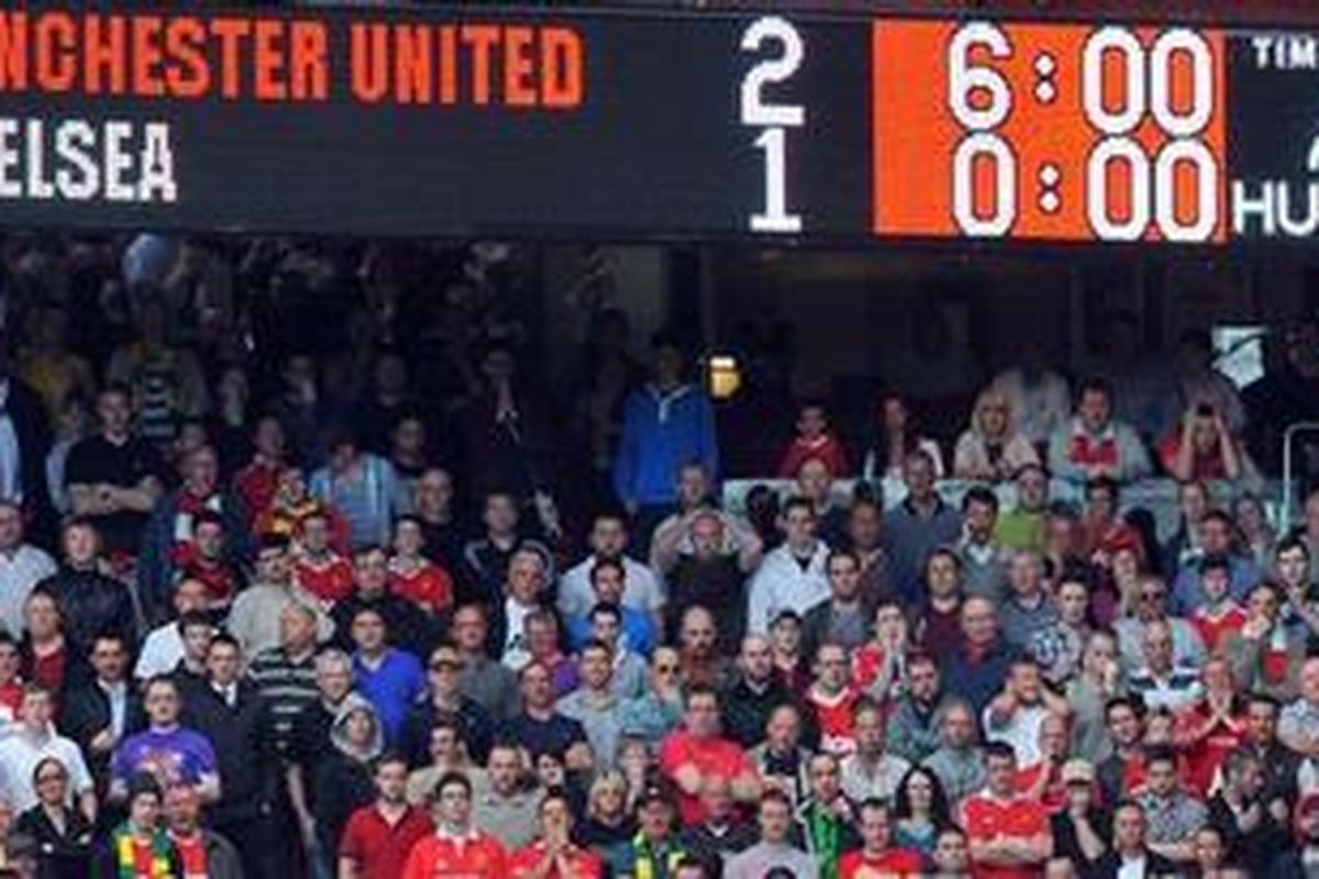 Suporter Manchester United pada pertandingan Premier League melawan Chelsea, di Old Trafford, akhir pekan lalu.