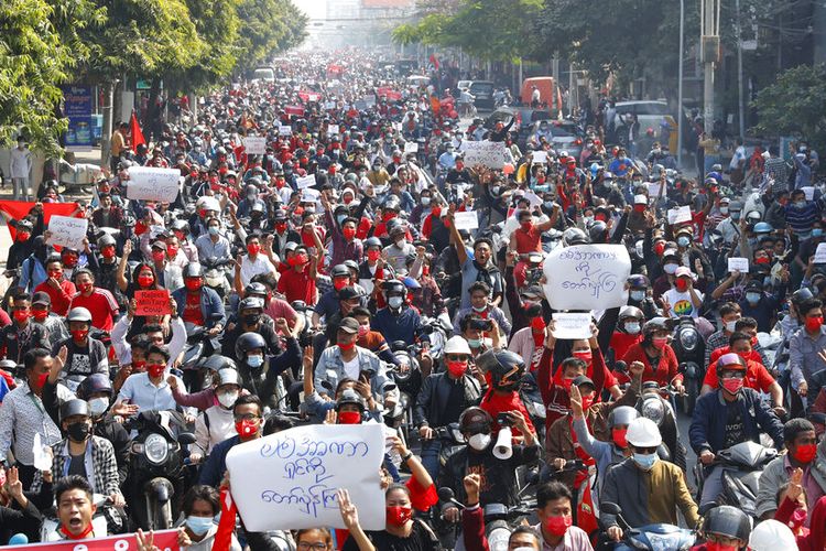 Protesters fill a street in Mandalay, Myanmar on Sunday, Feb. 7, 2021. Tens of thousands of people rallied against the military takeover in Myanmar's biggest city on Yangon Sunday and demanded the release of Aung San Suu Kyi, whose elected government was toppled by the army that also imposed an internet blackout. (AP Photo)