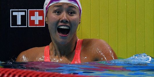 Perenang Cina Liu Xiang meluapkan kegembiraannya usai menjadi pemenang babak final 50 meter Gaya Punggung Putri Asian Games ke-18 Tahun 2018 di Aquatic Centre GBK, Senayan, Jakarta, Selasa (21/8/2018). Liu Xiang berhasil meraih medali emas sekaligus memecahkan rekor dunia pada nomor itu dengan catatan waktu 26.98 detik.  