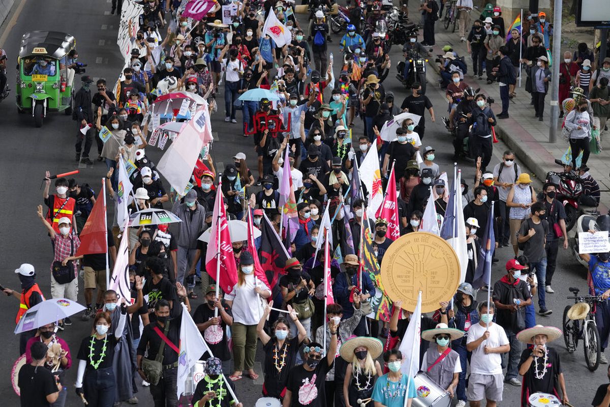 Pro-democracy supporters wearing face mask march on the road during a demonstration in Bangkok, Thailand, Thursday, June 24, 2021.  Anti-government protests  expected to resume in Bangkok after a long break due partly to a surge in Covid-19 cases. Gatherings are planned for several locations across the capital, despite health officials mulling a week-long lockdown in Bangkok  to control a rampant virus surge.