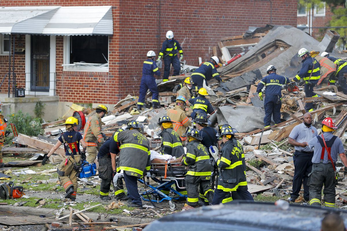 One woman is dead, and others remain trapped in debris following a massive Baltimore explosion on Monday morning.