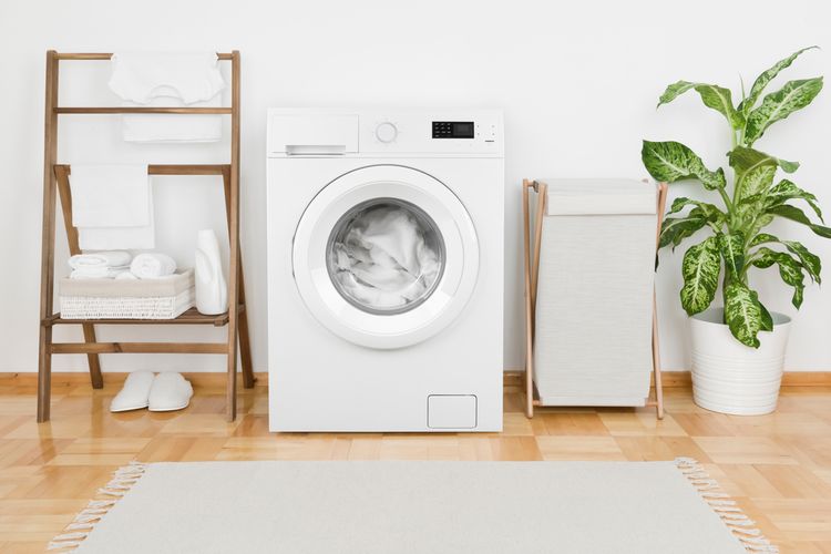 Ilustrasi mesin cuci dan ruangan mencuci pakaian.