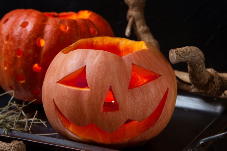 Illustration of a carved pumpkin for Halloween celebration.