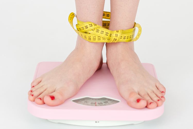 Ilustrasi berat badan, cara menurunkan berat badan saat puasa. 