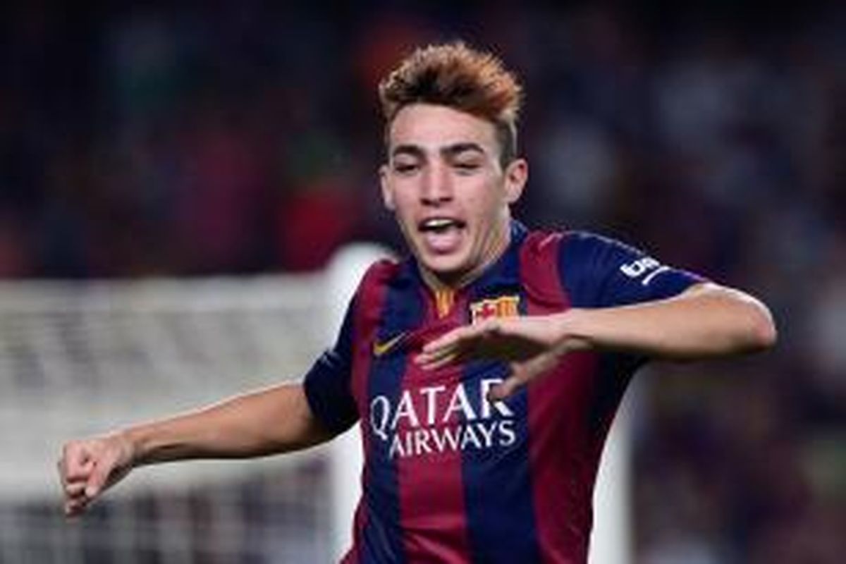 Striker muda Barcelona, Munir El Haddadi, seusai mencetak gol ke gawang Elche pada pertandingan Primera Division, Minggu (24/8/2014). 