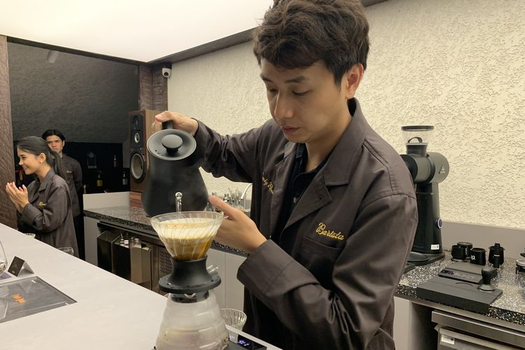 Ryan Wibawa, Head of Coffee Common Grounds and third winner of the 2024 World Brewer' Cup when serving coffee in the Trophy Room, Common Grounds Menteng Terra.