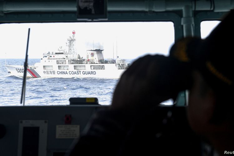 FILE - China Coast Guard ship is seen from an Indonesian Naval ship during a patrol at Indonesia's Exclusive Economic Zone (EEZ) sea in the north of Natuna Island, Indonesia, Jan. 11, 2020