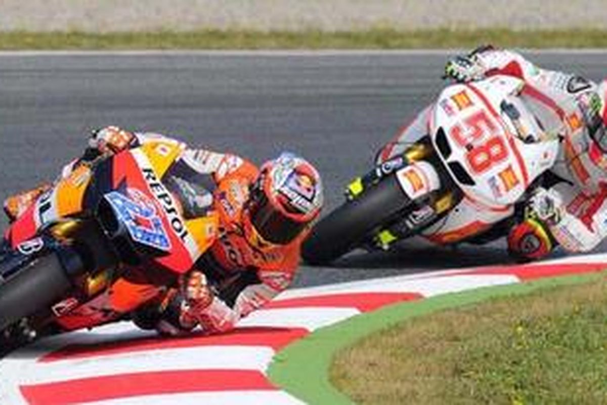 Pebalap Repsol Honda, Casey Stoner (kiri) dan pebalap Gresini Honda, Marco Simoncelli.