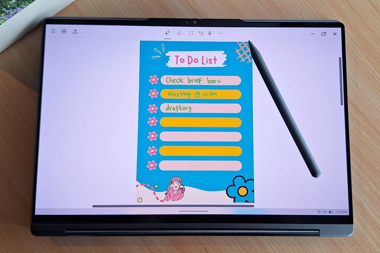 Fitur layar sentuh responsif Lenovo Yoga 9i 2-in-1 Aura Edition mendukung penggunaan Yoga Pen magnetik untuk mencatat ide dan membuat sketsa digital dengan presisi tinggi.