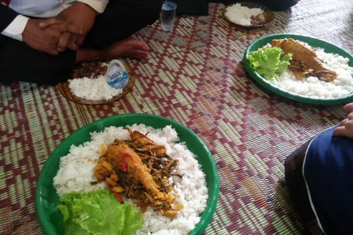 Arsik ikan mas sebagai sajian dalam jamuan makan pesta adat 