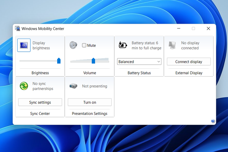 Ilustrasi cara mengatur kecerahan layar laptop Windows 11 lewat Mobility Center.