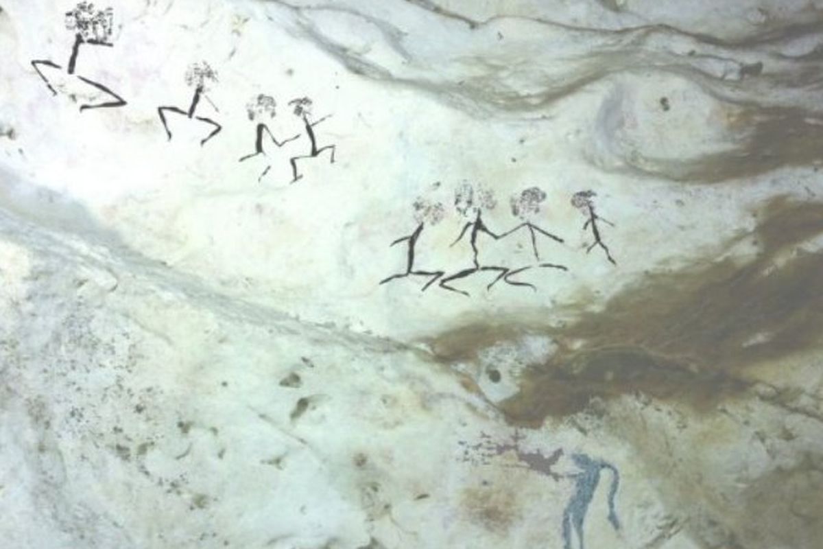 Gambar lukisan manusia yang diprediksi usianya sekitar 20.000 tahun di gua Kalimantan.
