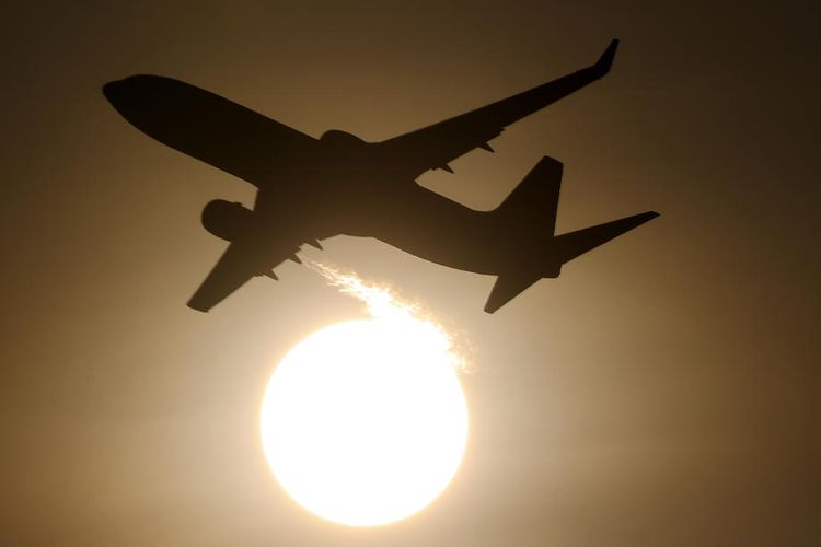 epa08132139 An airplane is silhouetted as it flies during sun rise in Sepang, Malaysia, 16 January 2020.  EPA-EFE/FAZRY ISMAIL