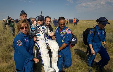 Expedition 59 astronaut Anne McClain of NASA  is carried to a medical tent shortly after she, Canadian Space Agency astronaut David Saint-Jacques, and Roscosmos cosmonaut Oleg Kononenko landed in their Soyuz MS-11 spacecraft near the town of Zhezkazgan, Kazakhstan on Tuesday, June 25, 2019 Kazakh time (June 24 Eastern time). McClain, Saint-Jacques, and Kononenko are returning after 204 days in space where they served as members of the Expedition 58 and 59 crews onboard the International Space Station. Photo Credit: (NASA/Bill Ingalls)
