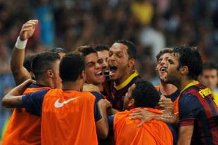 Para pemain Barcelona merayakan gol ke gawang Malaga pada laga yang berlangsung di Stadion La Rosaleda, Malaga, Minggu atau Senin (26/8/2013) dini hari WIB.
