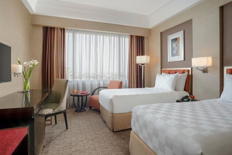 Kamar tipe Deluxe Simpang Lima di Hotel Ciputra Semarang Managed by Swiss-Belhotel International, salah satu hotel di Semarang dekat Simpang Lima.
