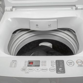 Ilustrasi mesin cuci bukaan atas. 