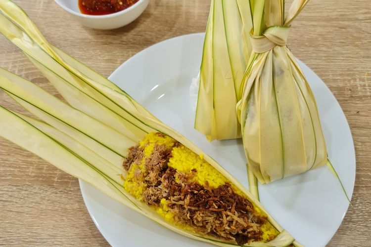 ilustrasi nasi kuning daun woka. 