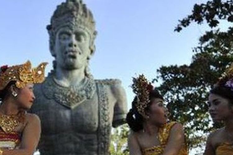 Some Balinese dancers share light moment after their traditional dance performance at Garuda Wisnu Kencana Cultural Park in Bali.  