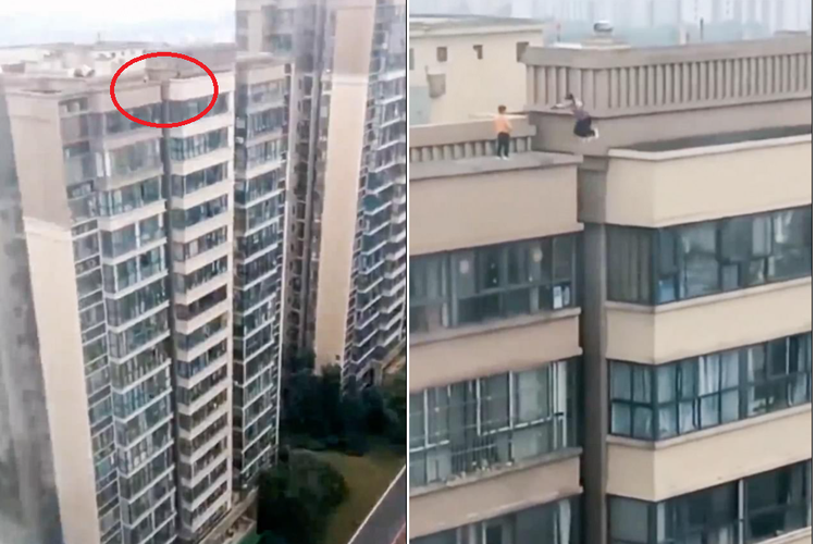Tangkap layar video dua anak muda terlihat bermain di dekat tepi atap gedung bertingkat di Xianning, provinsi Hubei, China.
