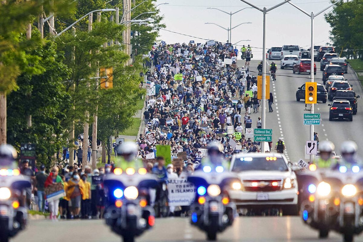 Thousands of people march through the streets during a Multi-Faith March to End Hatred after four members of a Muslim family were killed on Sunday in what police called a hate crime, Friday, Jun 11, 2021 in London Ontario. (Geoff Robins/The Canadian Press via AP)