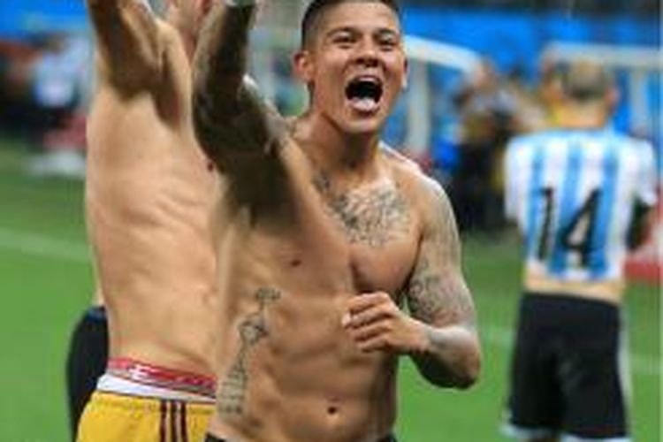 Sejumlah tato di tubuh Marcos Rojo.