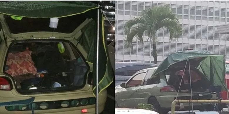 Mobil Pak Adi yang digunakan untuk berkemah di luar Rumah Sakit Raja Permaisuri Bainun (HRPB), Ipoh, Malaysia, untuk menunggu anaknya yang dirawat karena tumor otak, Januari 2023.