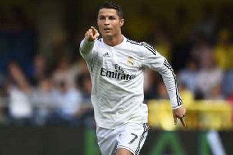 Ekspresi gelandang Real Madrid Cristiano Ronaldo usai mencetak gol ke gawang Villarreal, pada laga Primera Division, di El Madrigal, 27 September 2014.