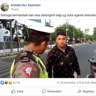 Sebuah tangkapan layar dari seorang polisi yang menilang pengawal ambulance.