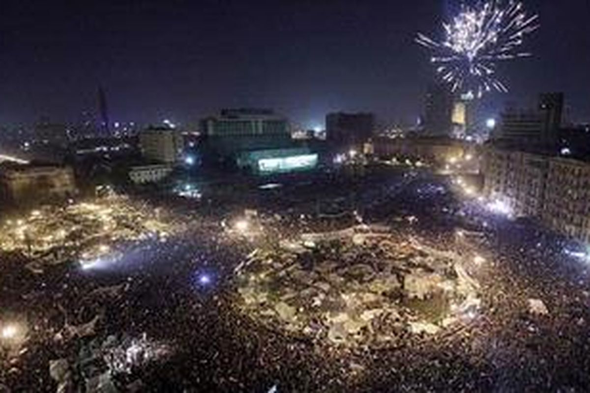 Spectacular: Fireworks light up the sky above Tahrir Square as the party continued long into the night  