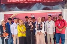 Syakur-Putri Daftar Pilkada Garut Mengenakan Baju Pangsi