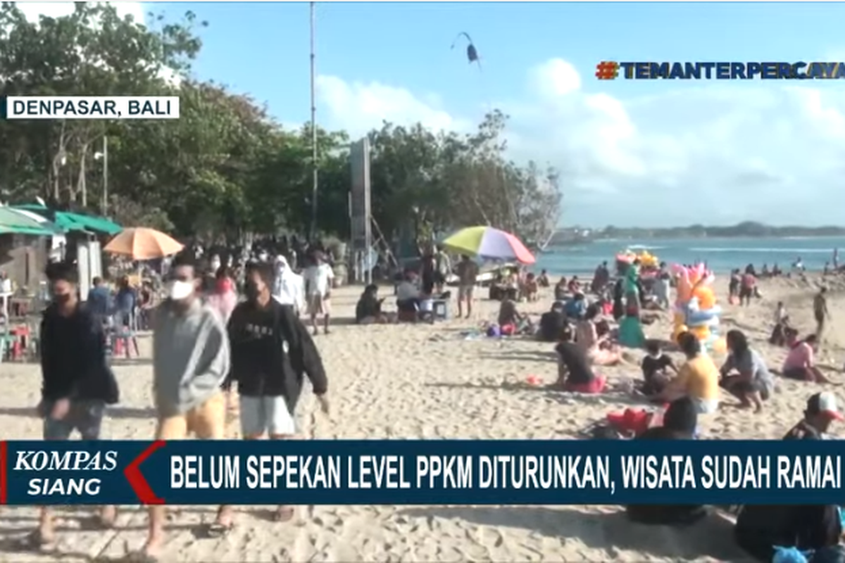 Tangkapan layar siaran Kompas TV, Senin (20/9/2021). Belum sepekan level PPKM diturunkan, wisatawan ramai mengunjungi pantai di Bali pada Minggu (19/9/2021).