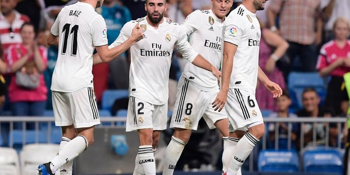 Bek sayap Real Madrid, Dani Carvajal (ke-2 dari kiri), merayakan gol yang ia cetak ke gawang Getafe bersama rekan-rekannya dalam laga pembuka La Liga Spanyol 2018-2019 di Stadion Santiago Bernabeu, Madrid, Spanyol, 19 Agustus 2018.