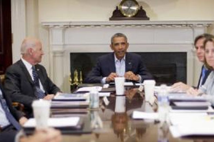 Presiden Obama dan Wapres AS Joe Biden saat bertemu para pejabat keamanan nasional AS.
