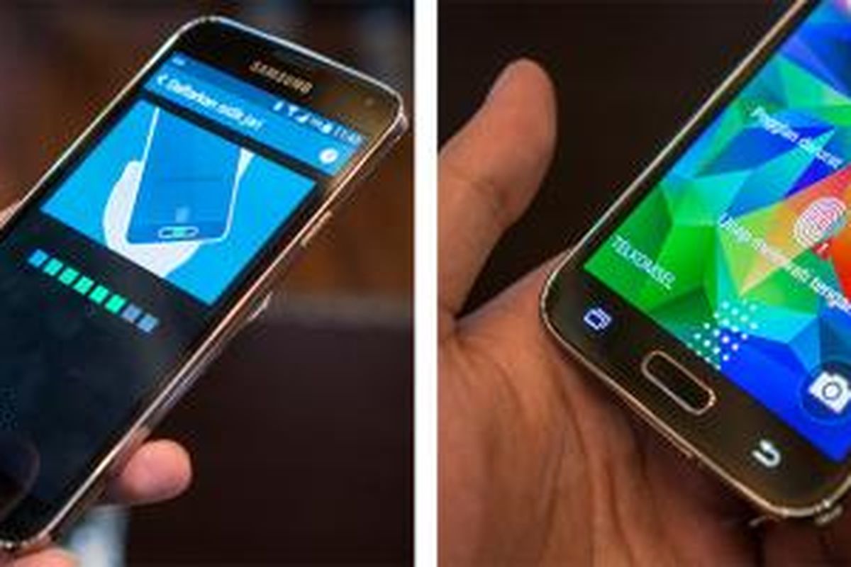 Pemindai sidik jari pada Galaxy S5 mengharuskan pengguna menyapukan jari secara vertikal
