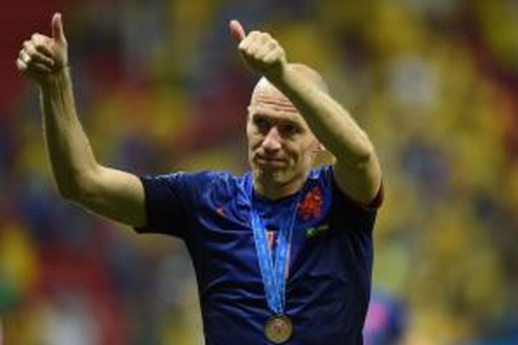 Ekspresi penyerang Belanda, Arjen Robben, setelah mendapatkan medali peringkat ketiga Piala Dunia. Belanda menjadi second runner-up setelah menang 3-0 atas Brasil, di Estadio Nacional, Braslia, Sabtu (12/7/2014).