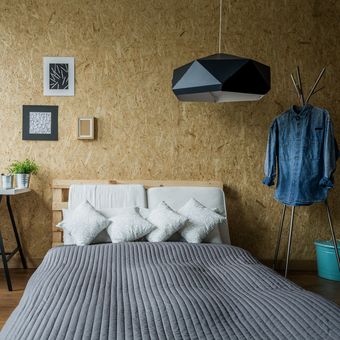 Ilustrasi kamar tidur sempit bergaya minimalis.