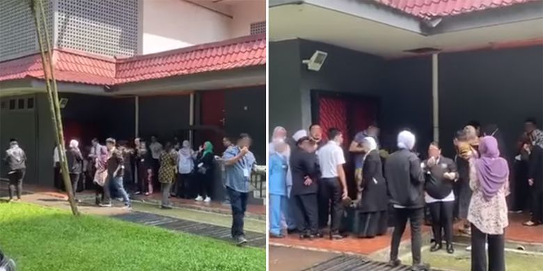 Tangkapan layar dari akun Facebook Info Semasa menunjukkan sekumpulan orang berkumpul untuk makan durian di luar gedung yang diyakini tempat vaksinasi di Johor, Malaysia.
