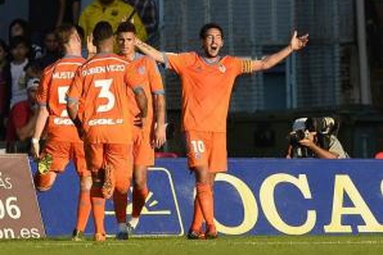 Kapten Valencia, Daniel Parejo, merayakan gol ke gawang Celta Vigo, Sabtu (7/11/2015). 