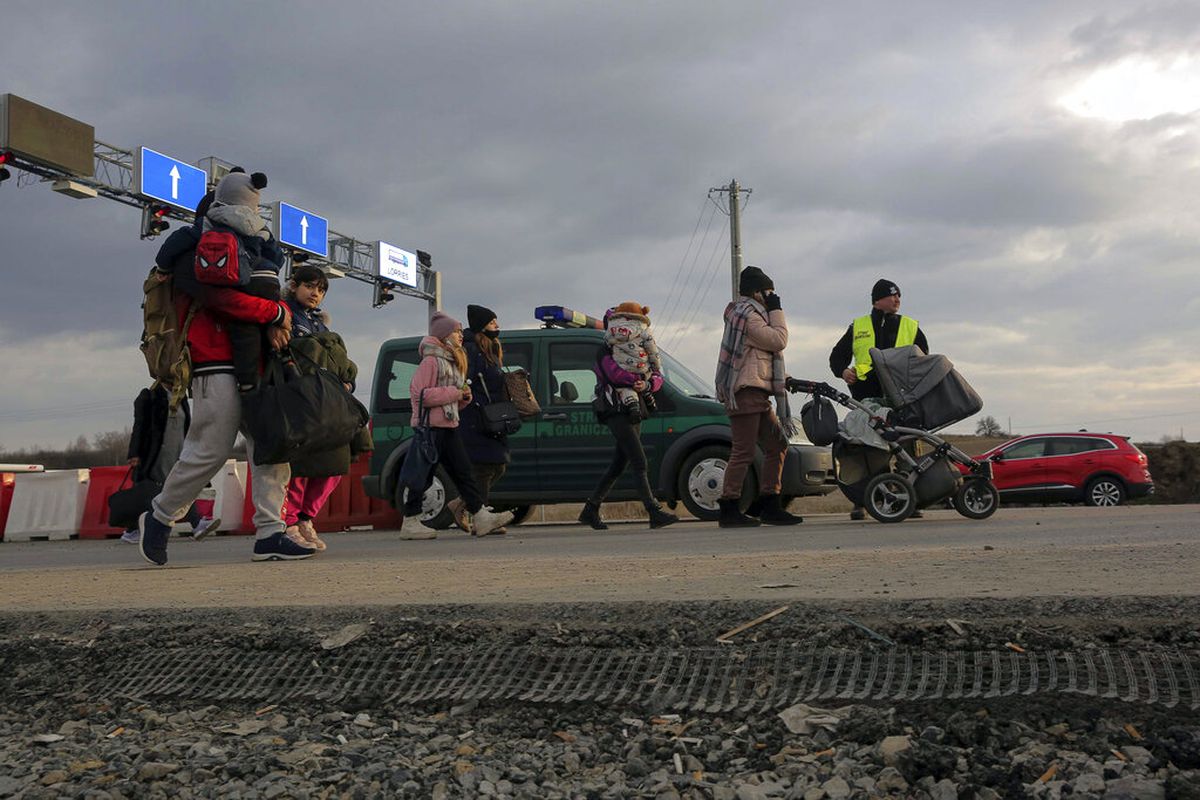 Ukrainian refugees arrive at the Medyka border crossing, Poland, Saturday, Feb. 26, 2022. (AP Photo/Visar Kryeziu)