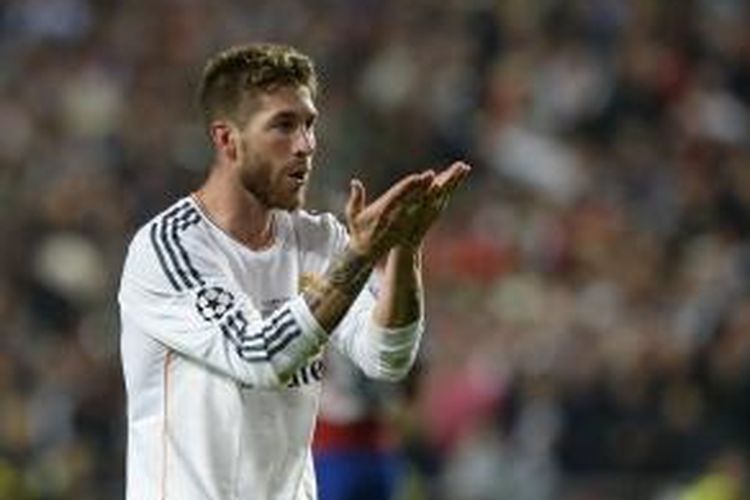 Bek Real Madrid, Sergio Ramos, merayakan golnya ke gawang Atletico Madrid, pada final Liga Champions, di Estadio da Luz, Lisabon, Sabtu (24/5/2014).