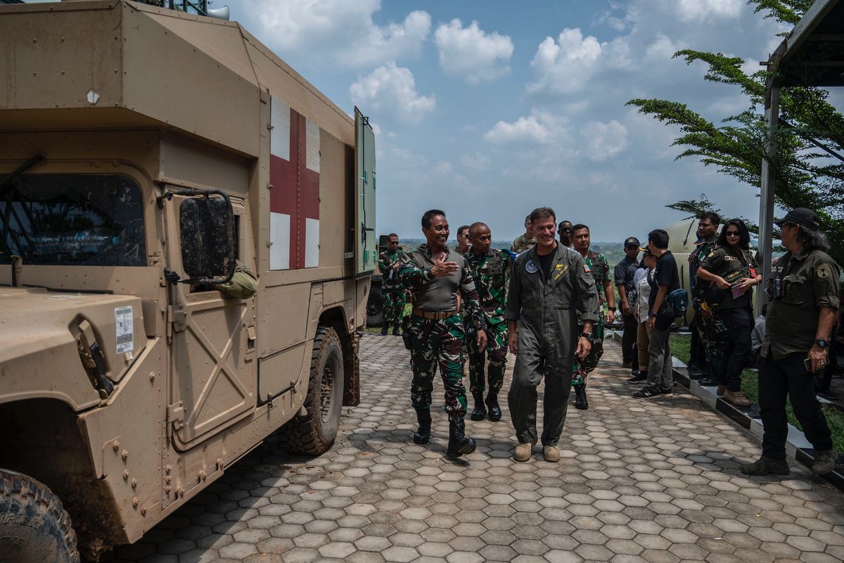 Commander of the US Indo-Pacific Command Admiral John Aquilino (R) walks with Indonesian Armed Forces Chief General Andika Perkasa during the Super Garuda Shield 2022 joint military exercises in Baturaja, South Sumatra on August 12, 2022. (Photo by Juni Kriswanto / AFP)