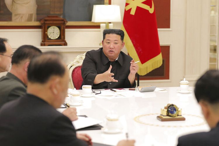 In this photo provided by the North Korean government, North Korean leader Kim Jong Un, center, attends a meeting of ruling party Workers' Labor Party of Korea in Pyongyang, North Korea Tuesday, May 17, 2022. North Korea on Wednesday, May 18, reported 232,880 new cases of fever and another six deaths as leader Kim Jong Un accused officials of 'immaturity' and 'slackness' in handling the escalating Covid-19 outbreak ravaging across the unvaccinated nation. Independent journalists were not given access to cover the event depicted in this image distributed by the North Korean government. The content of this image is as provided and cannot be independently verified. Korean language watermark on image as provided by source reads: KCNA which is the abbreviation for Korean Central News Agency. (Korean Central News Agency/Korea News Service via AP, File)
