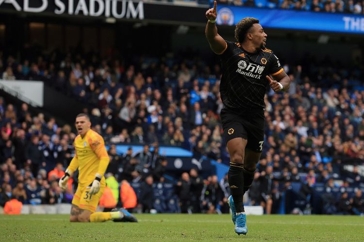 Wolverhampton Wanderers Spanish striker Adama Traore celebrates scoring the opening goal during the English Premier League football match between Manchester City and Wolverhampton Wanderers at the Etihad Stadium in Manchester, north west England, on October 6, 2019. (Photo by Lindsey Parnaby / AFP) / RESTRICTED TO EDITORIAL USE. No use with unauthorized audio, video, data, fixture lists, club/league logos or live services. Online in-match use limited to 120 images. An additional 40 images may be used in extra time. No video emulation. Social media in-match use limited to 120 images. An additional 40 images may be used in extra time. No use in betting publications, games or single club/league/player publications. / 